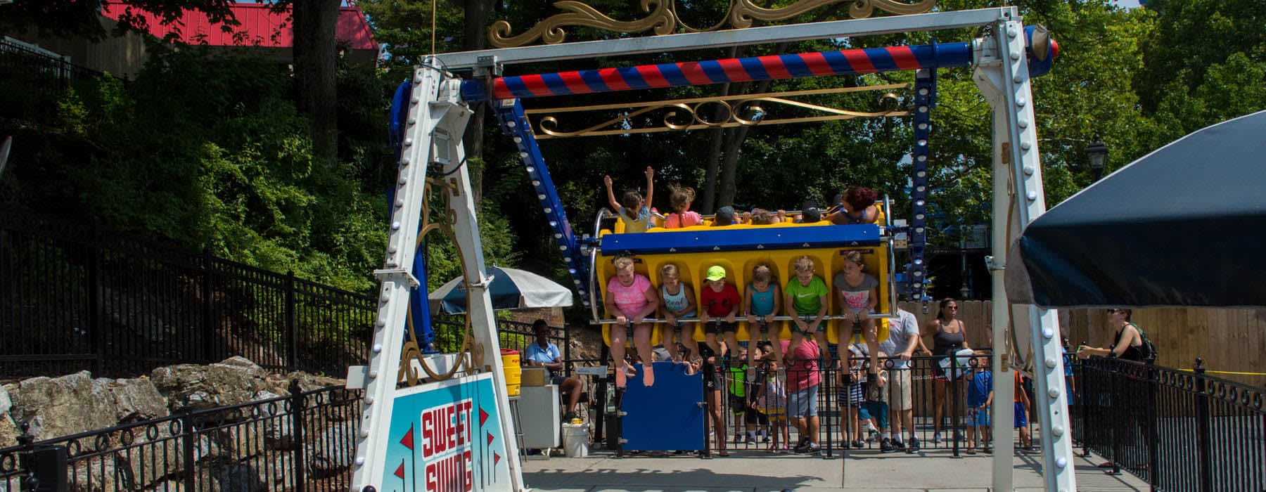 Children riding the Sweet Swing ride at Hersheypark