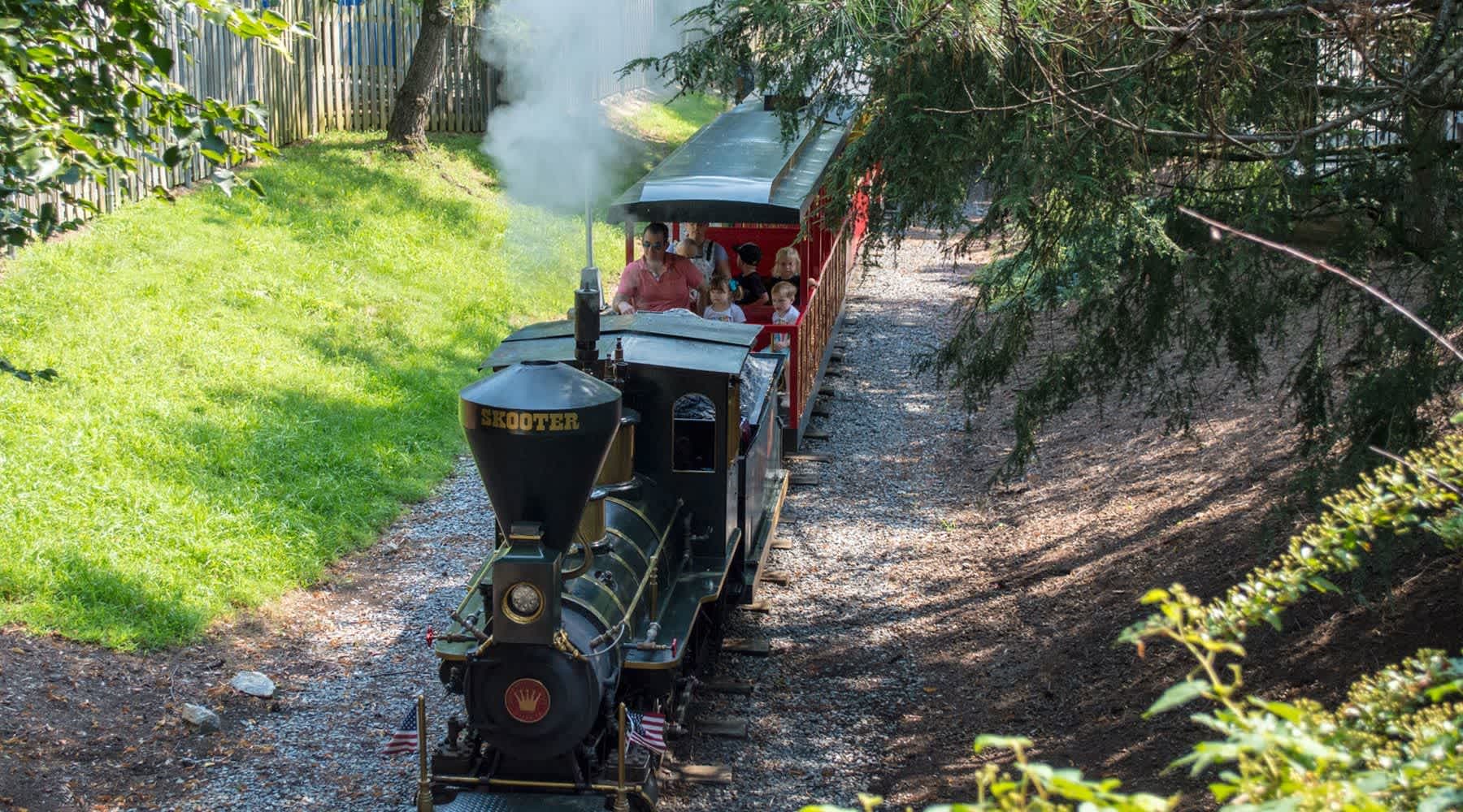 People riding on the Dry Gulch Railroad ride