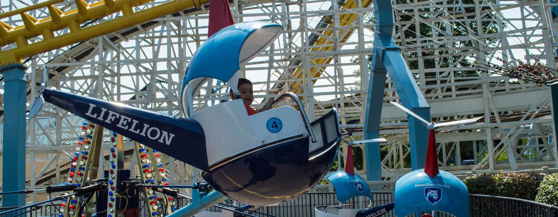 Child riding the Helicopters at Hersheypark