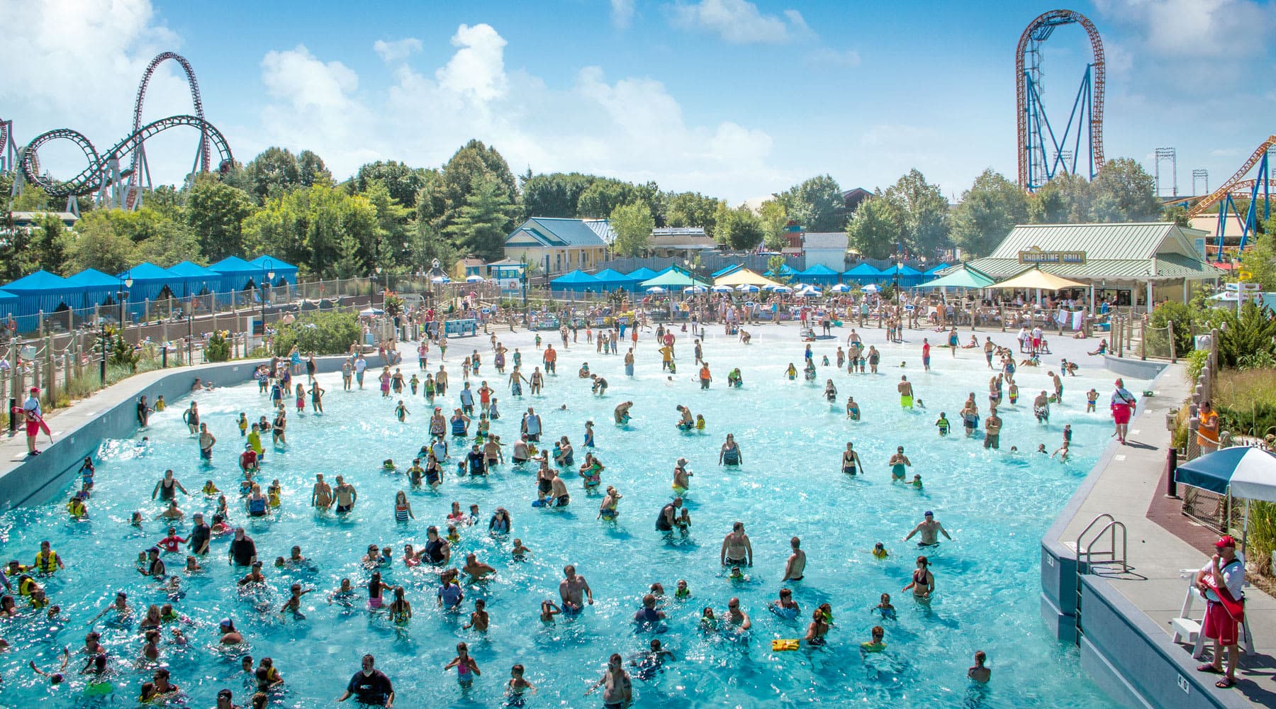 Beautiful View of People in the Shore Wave Pool at Hersheypark with Coasters in the Background