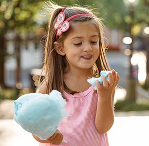 Girl eating Cotton Candy