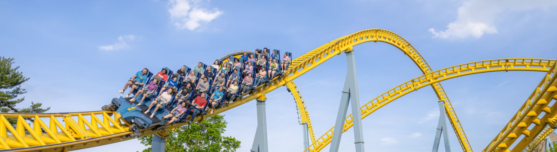 Family taking picture with Reese character at Hersheypark