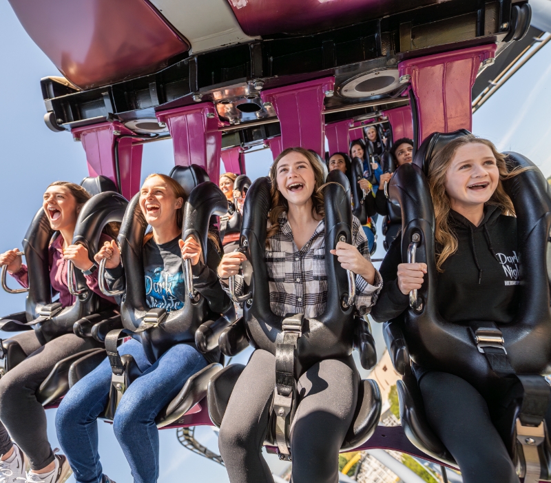 People riding Candymonium Roller Coaster