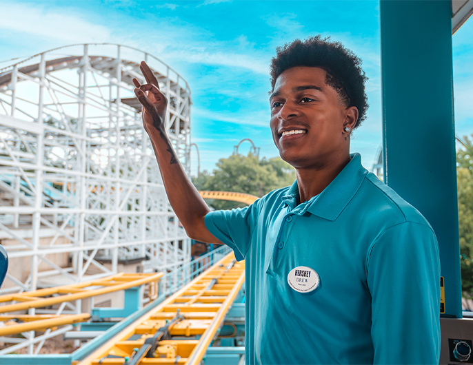 Hersheypark employee standing near a rollercoaster