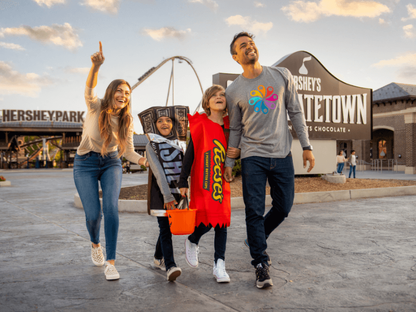 Family in costumes walking through Hersheypark