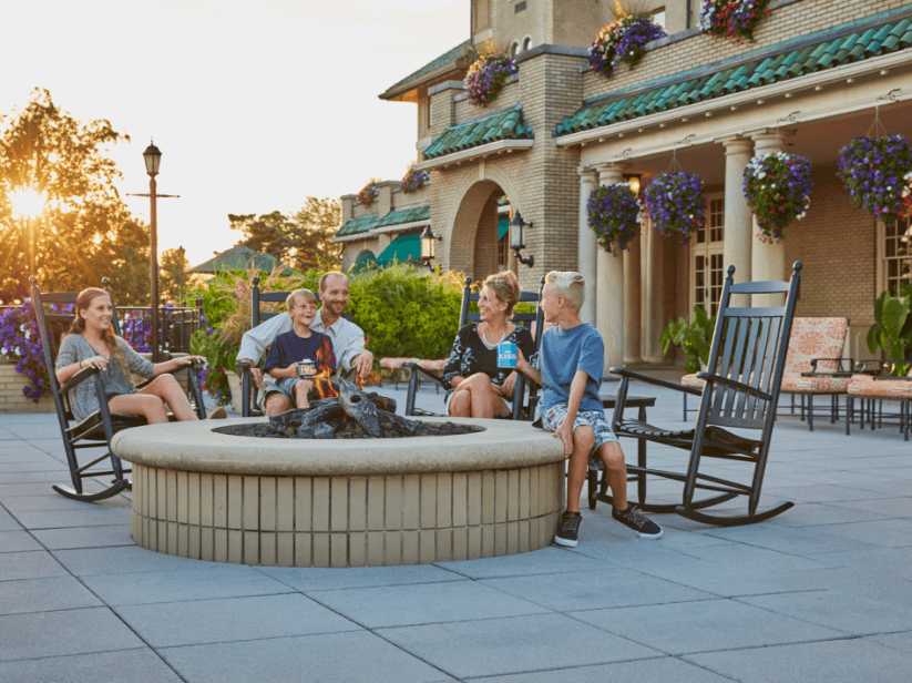 Family sitting around fire pit