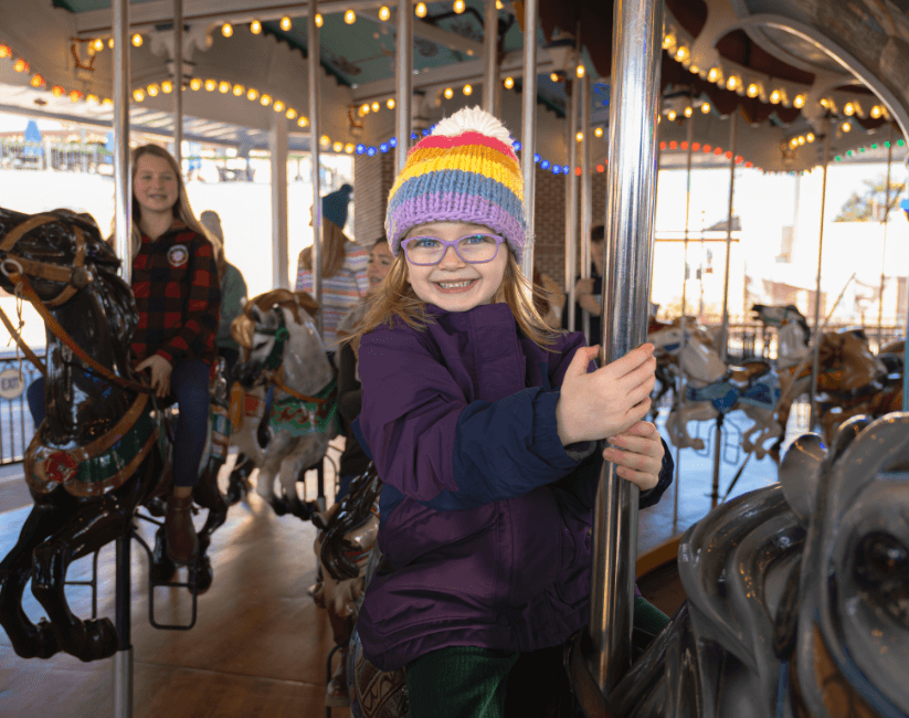 A child riding the carousel at Hersheypark