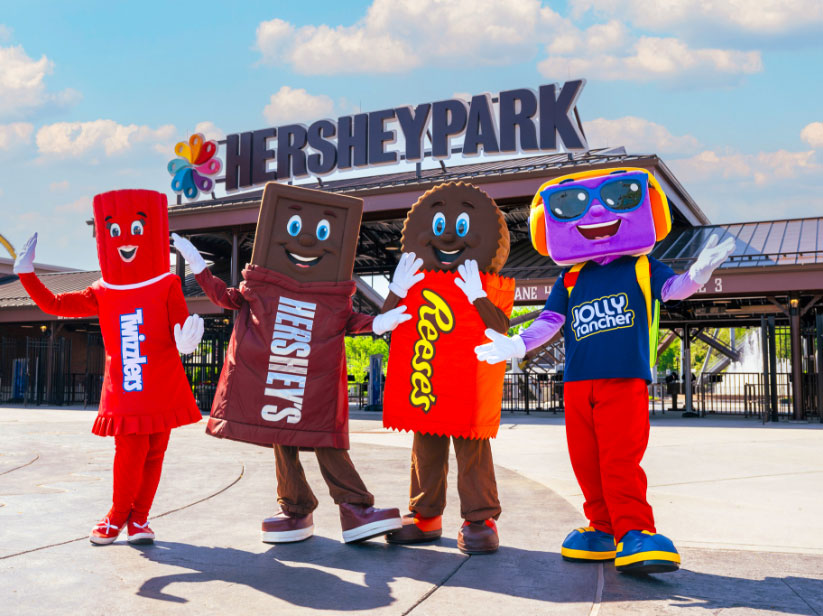 Hershey mascots posing in front of Hersheypark
